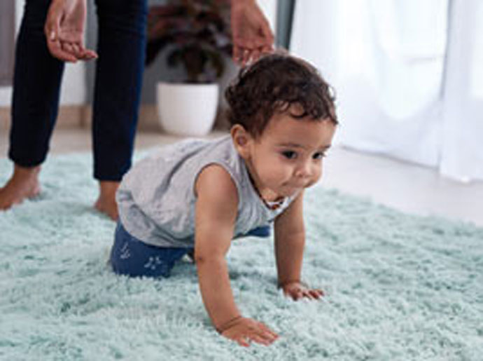 kid on rug