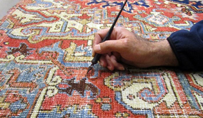 A professional color correcting a rug