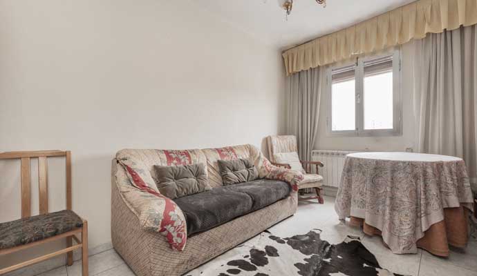 cowhide rug on the floor of a living room